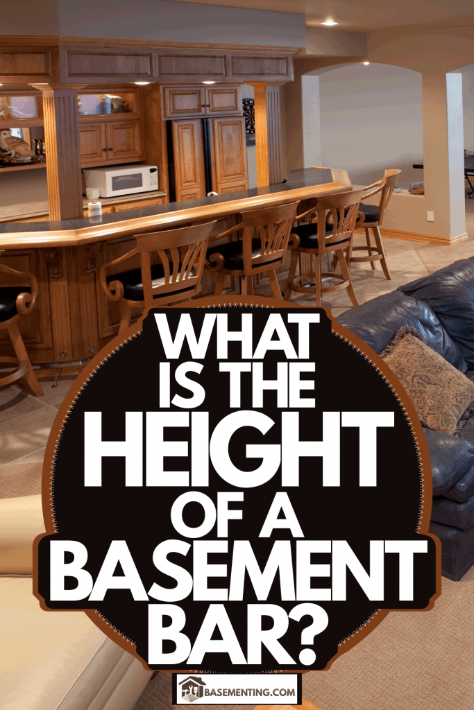 A rustic inspired basement interior with carpeted flooring, black leather sectional sofa, and wooden chairs and furnitures, What Is The Height Of A Basement Bar?