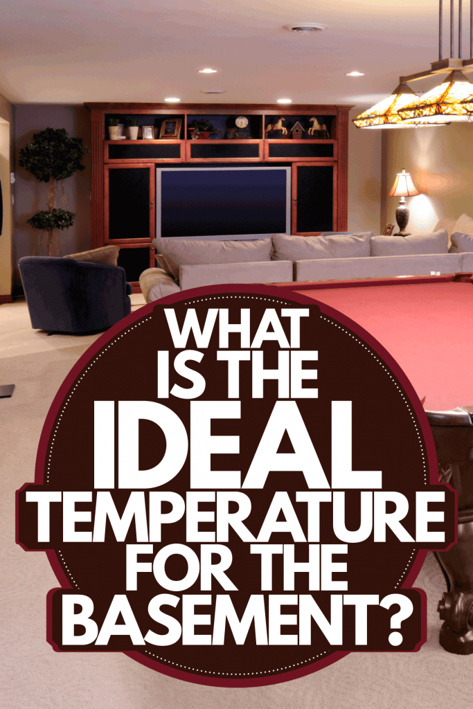 Interior of a mid century themed basement with dangling lamps, a pool table, and carpeted flooring, What Is The Ideal Temperature For A Basement?