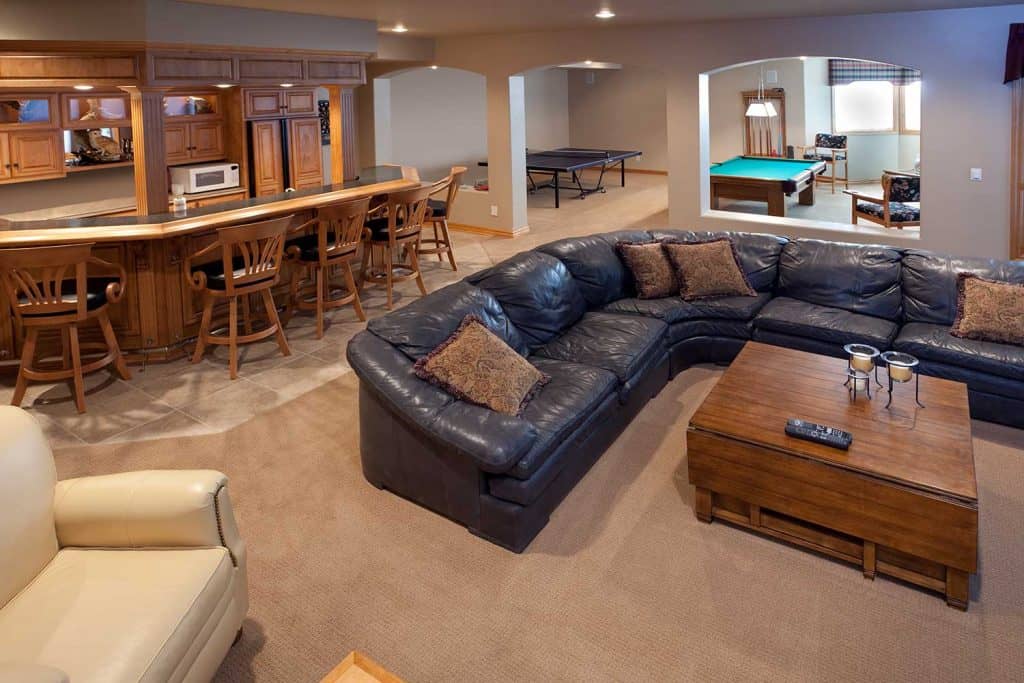 Excellent finished basement bar, lounge, game room, pool table and sofa