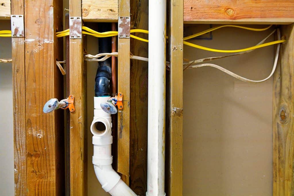 Rough-in plumbing and electrical installation in home