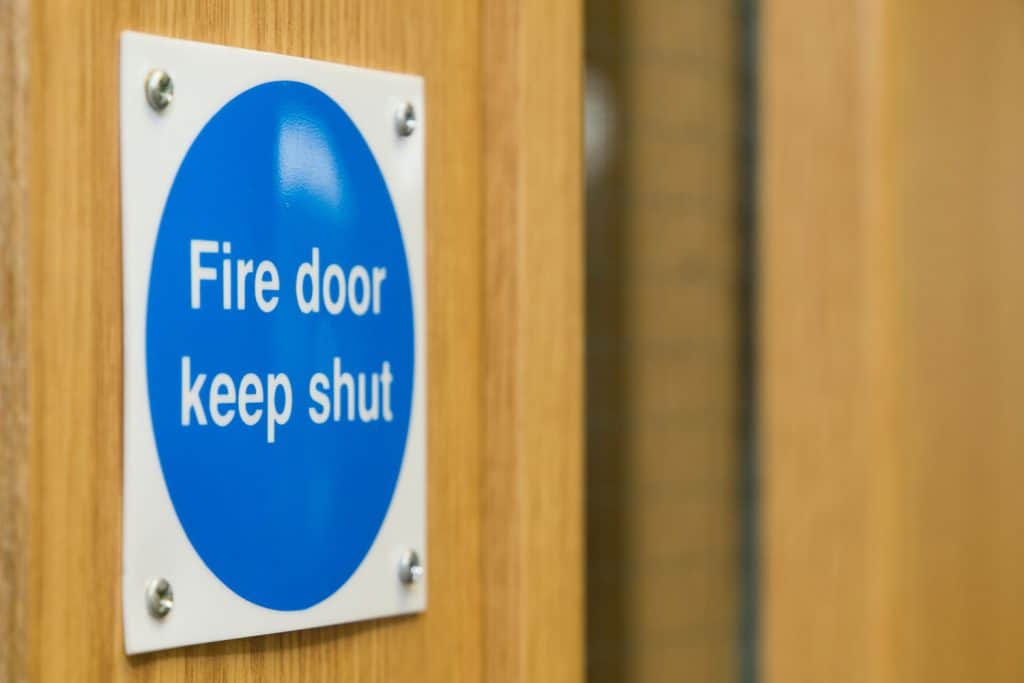 A fire door sign installed on the wall