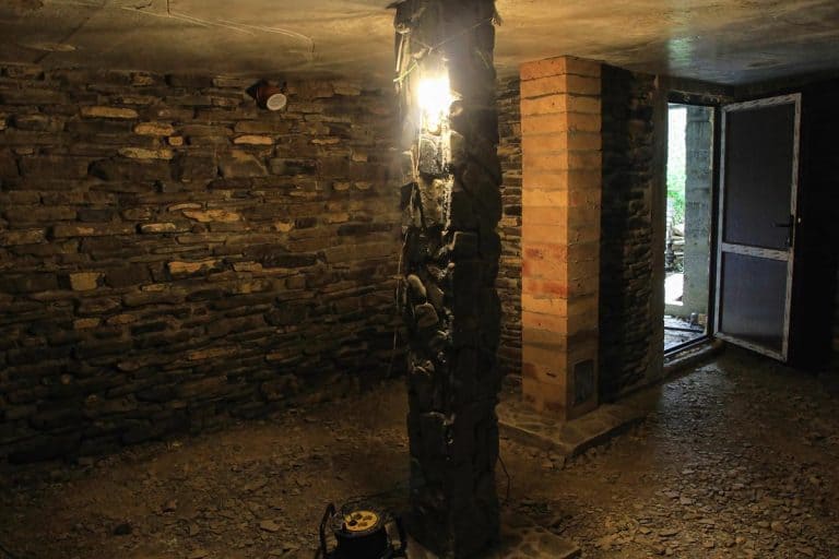 Dark basement with stone wall, Can You Finish A Basement With A Stone Foundation? [And How To]