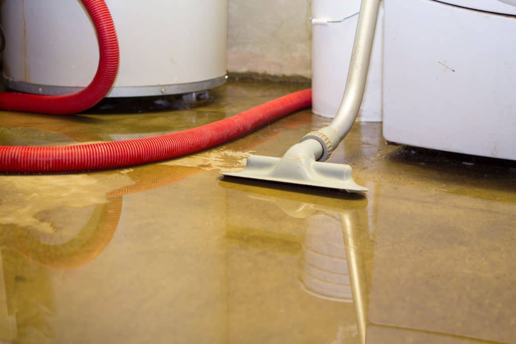 A flooded basement with vacuum for removing water