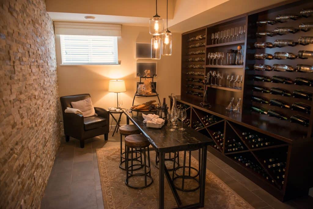 A modern and rustic basement with a large wine cellar