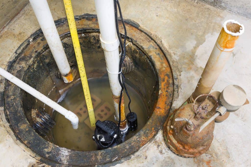Plumbers materials and a sump pump used on the floor drain