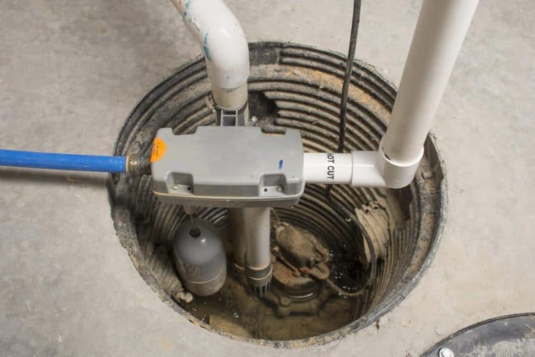 A sump pump installed at home with a water powered backup system, Does A Crawl Space Need A Sump Pump?