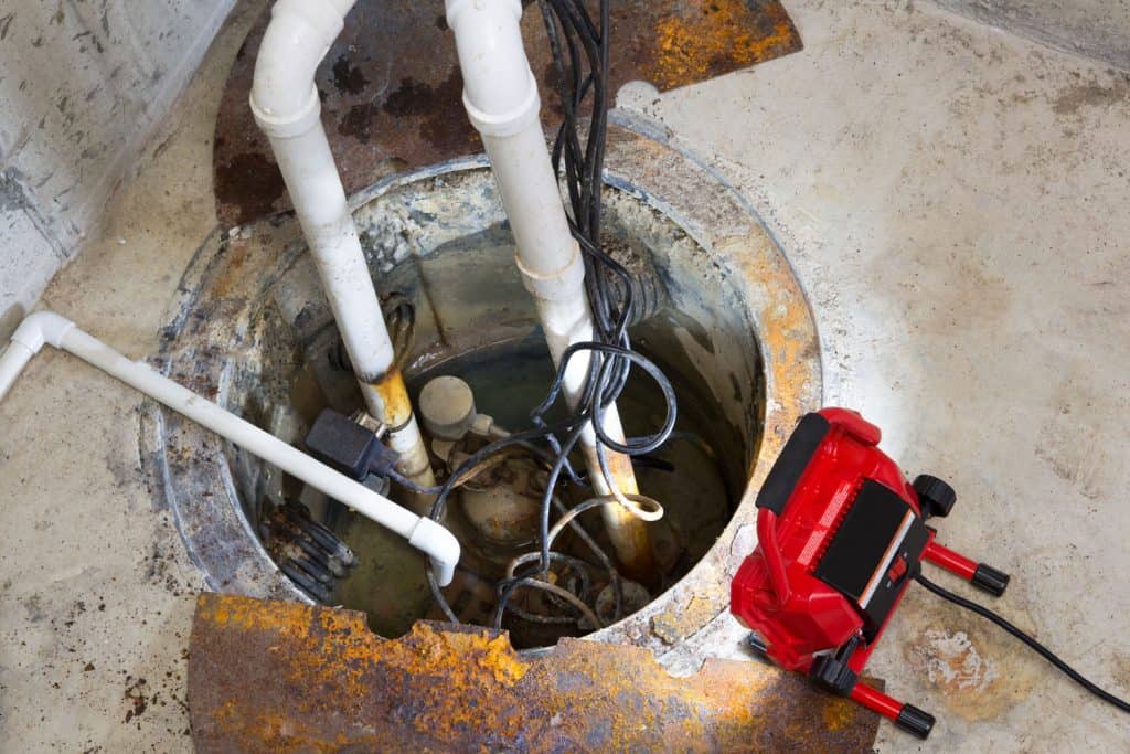 A sump pump used in draining the water in the basement