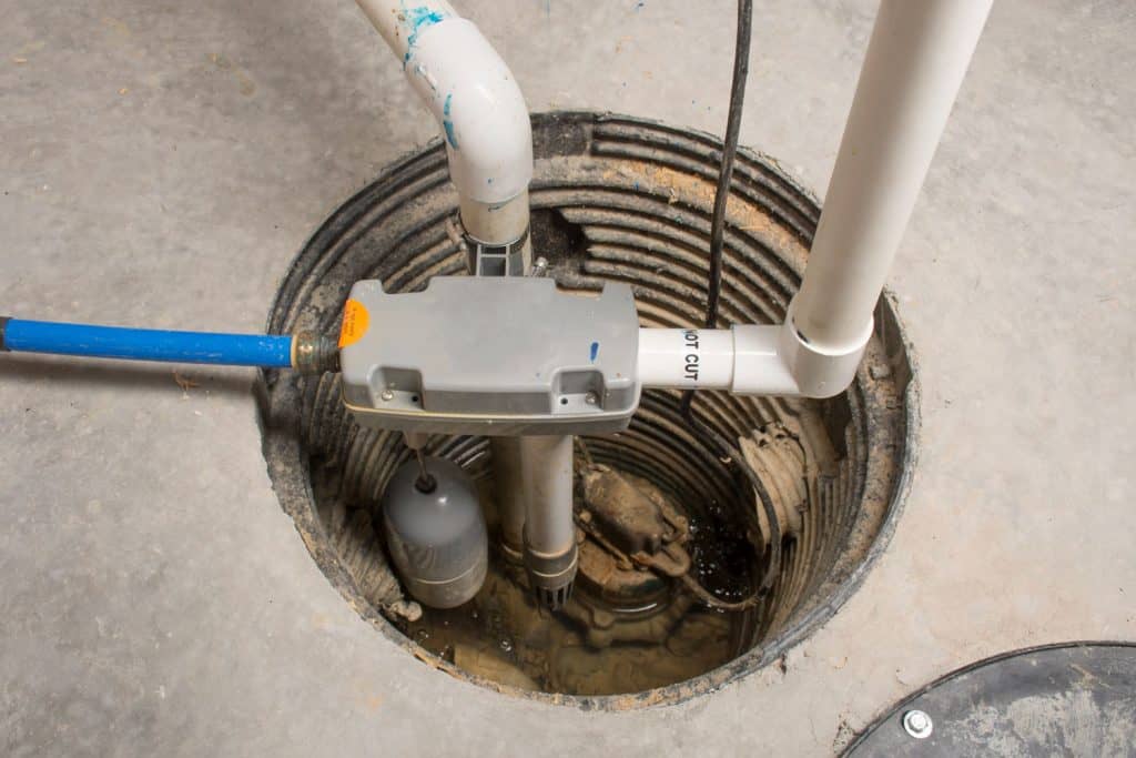 A sump pump used in draining water inside the basement floor drain