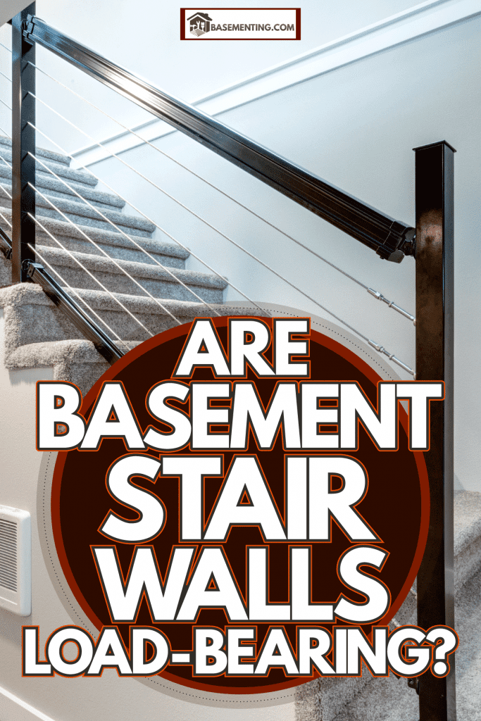 A basement stair with carpeted flooring and metal railing, Are Basement Stair Walls Load-Bearing?