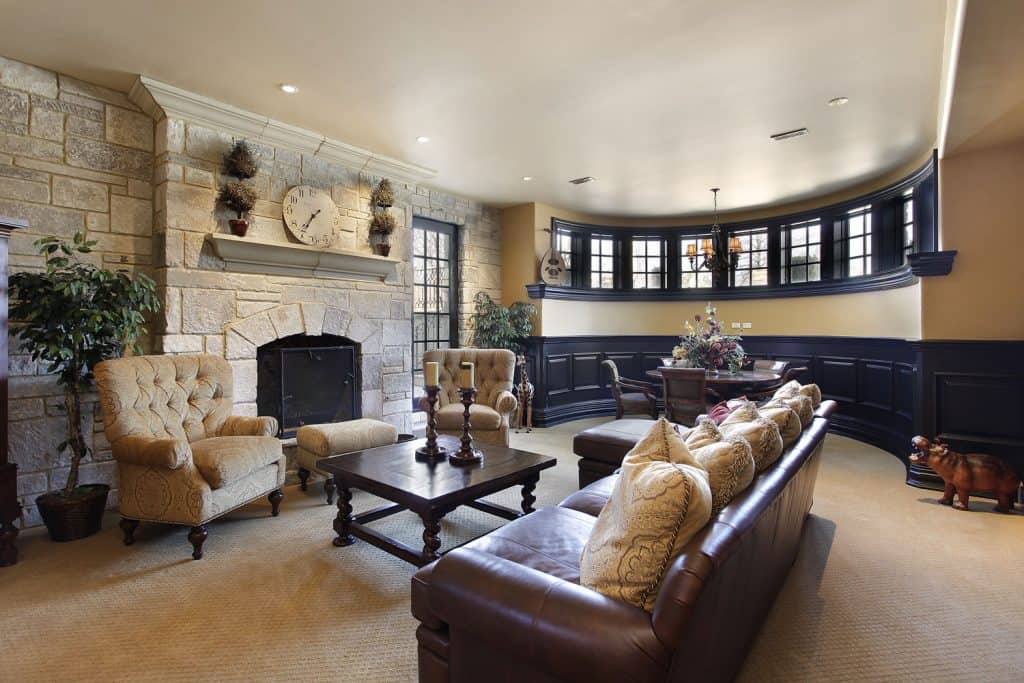 Basement-in-luxury-home-with-stone-fireplace