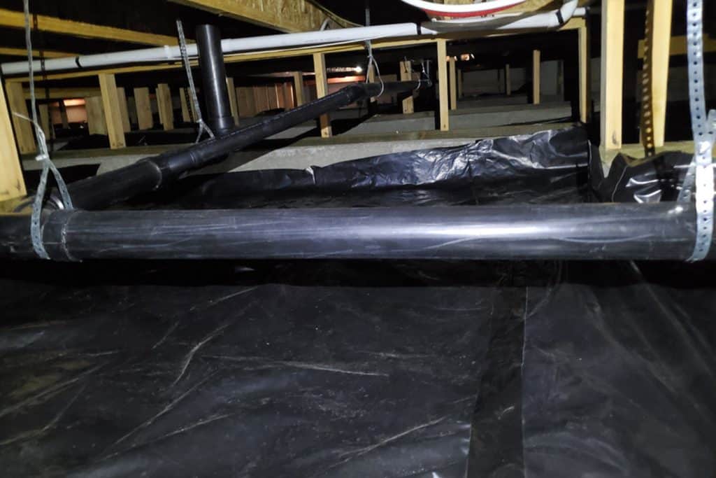 Crawlspace under a residential building with new vapor barrier, Is Crawl Space Encapsulation A Good Idea - The Pros And ConsCrawlspace under a residential building with new vapor barrier, Is Crawl Space Encapsulation A Good Idea - The Pros And Cons