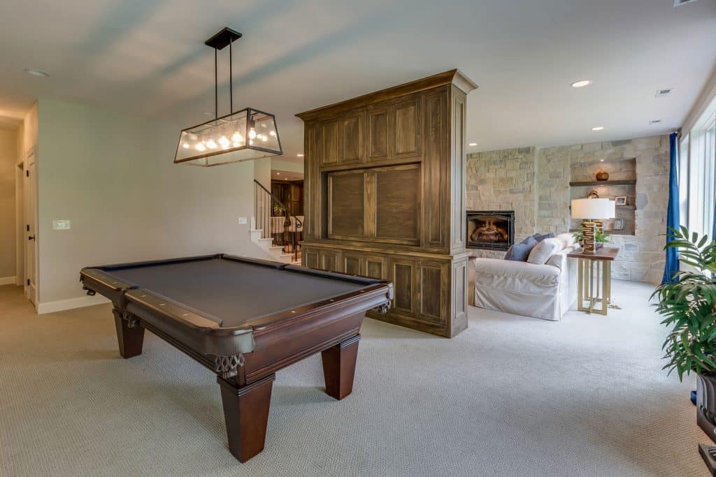 luxury walkout basement with living area and billiard