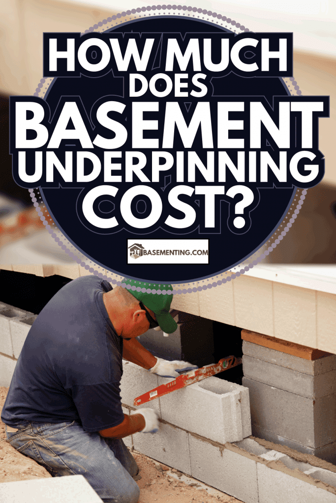 Man with Level Laying Concrete Block Skirting. How Much Does Basement Underpinning Cost