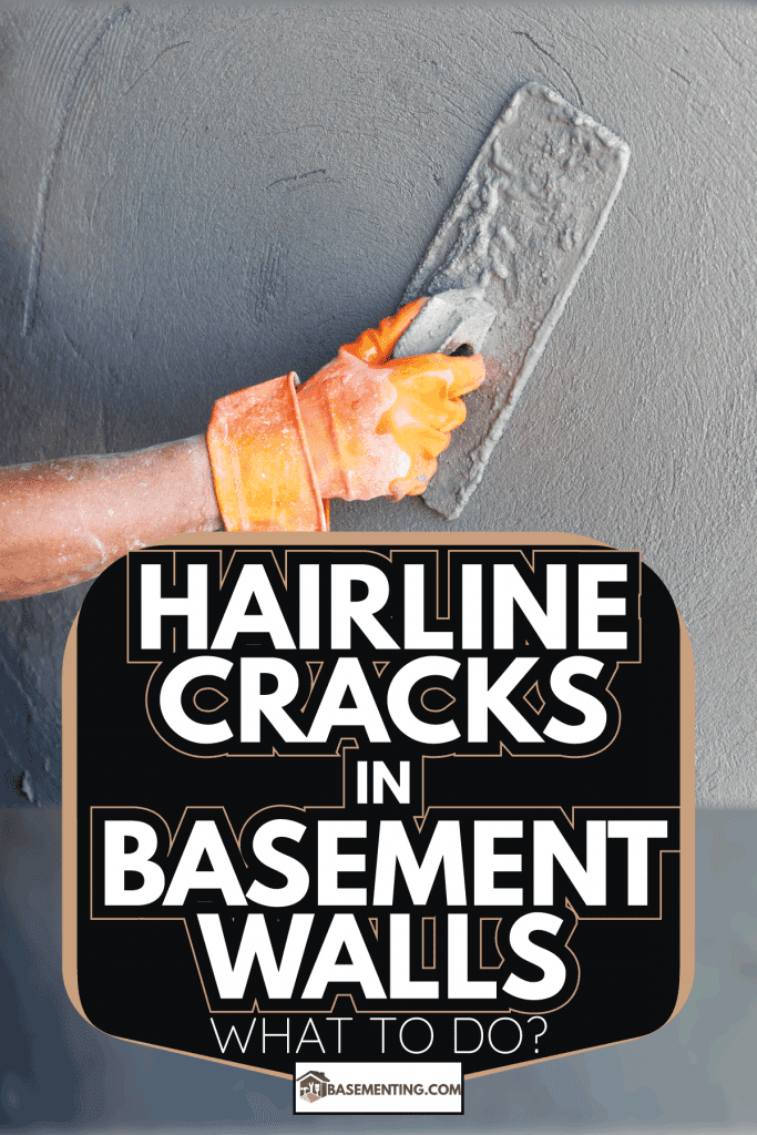 Plasterer concrete worker at wall of house wall repair. Hairline Cracks In Basement Walls—What To Do
