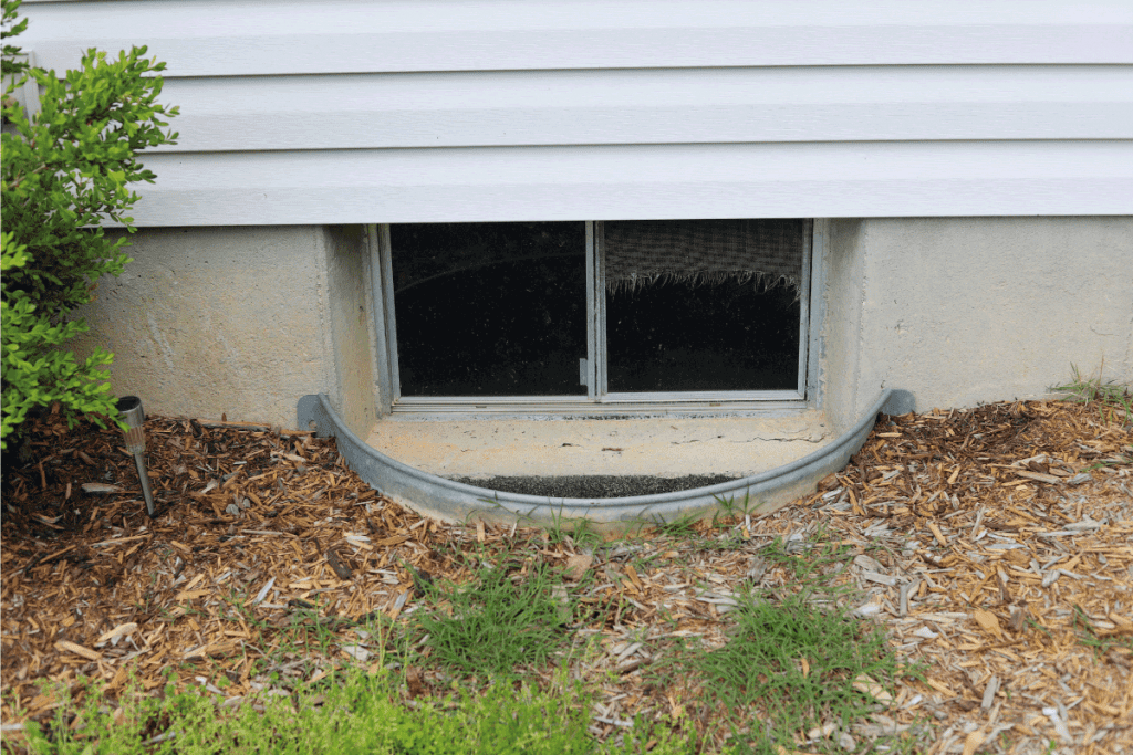 basement window well of a residential home. How Big Should A Basement Window Be