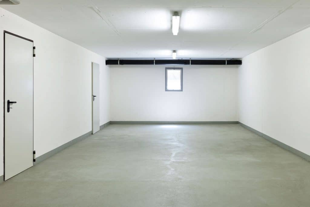 Interior of an empty white walled basement
