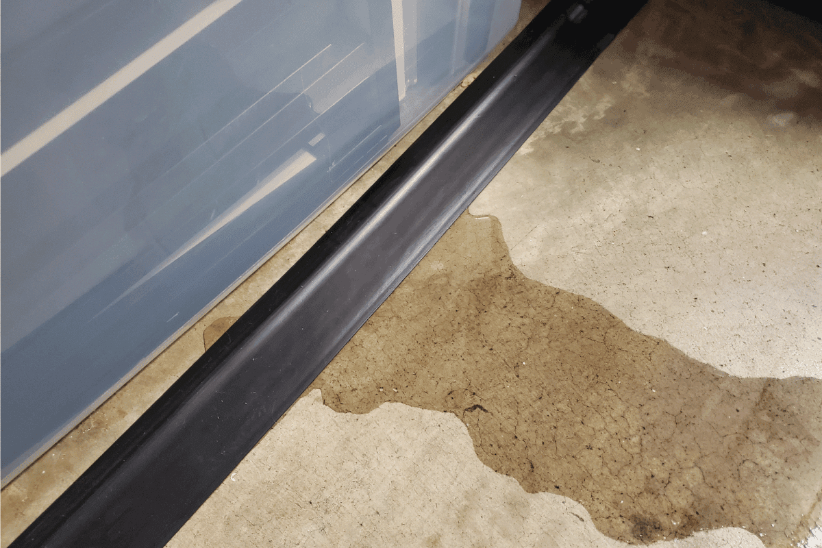 sweaty concrete floor with puddle of water. Can Basement Floors Sweat [And What To Do About It]
