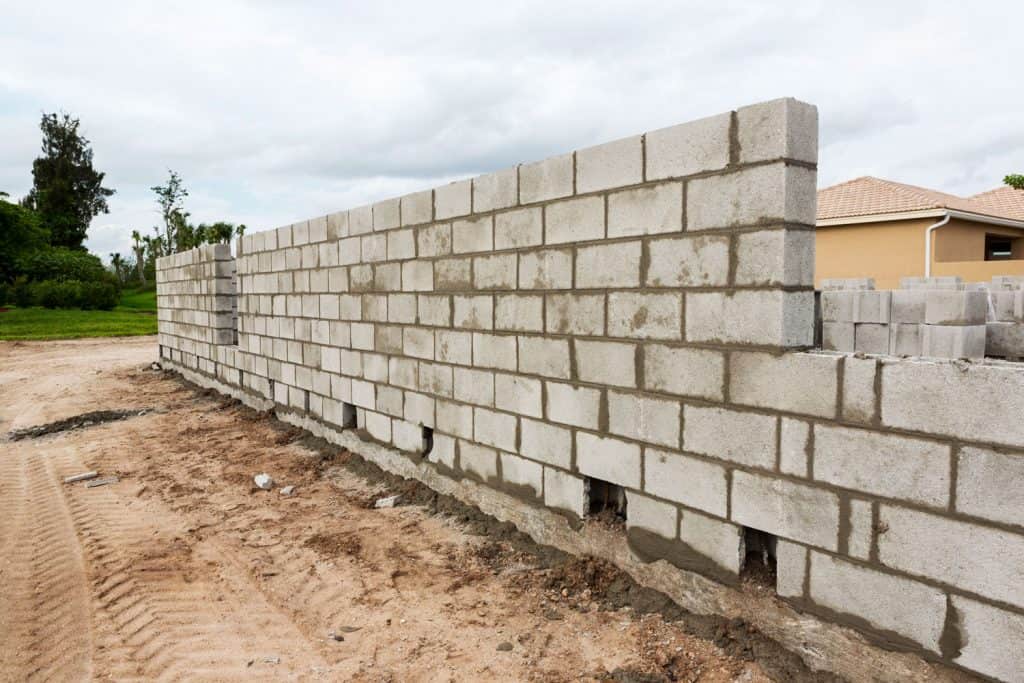 A big sized cinder block wall for a residential house, Cinder Block Vs. Poured Concrete Walls In Basement: Which Is Better?