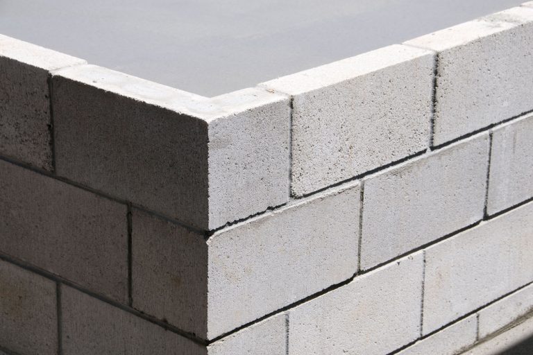 A corner of a cinder block wall, Can You Tile Cinder Block Walls? [And How To]