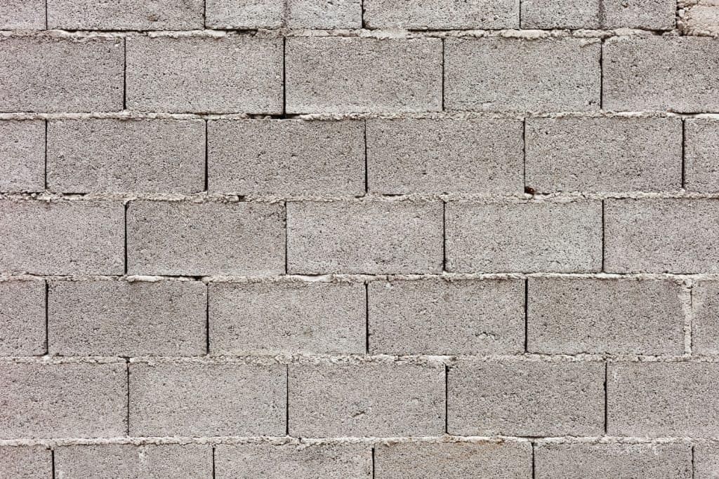 A detailed photo of a cinder block wall