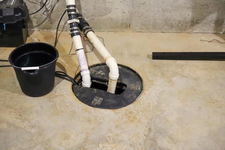 A sump pump in a home basement, Why Is My Basement Watchdog Beeping? [Your Sump Pump Backup Troubleshooting Guide]