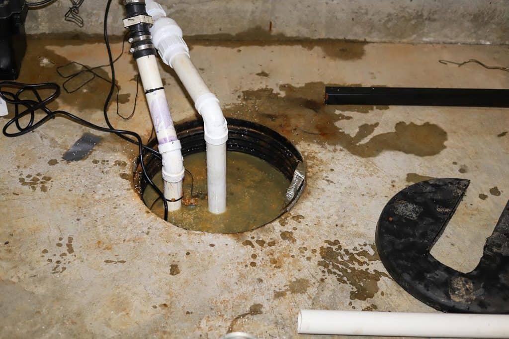 A sump pump in a home basement plumbing repair