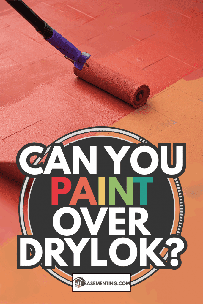 Contract painter painting a floor on color red for waterproofing. Can You Paint Over Drylok