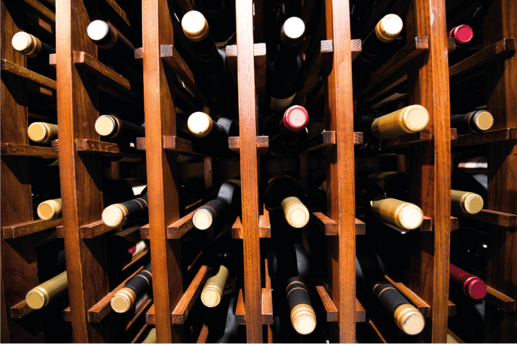 Group of wine bottles on wine rack. Does A Wine Cellar Need Ventilation