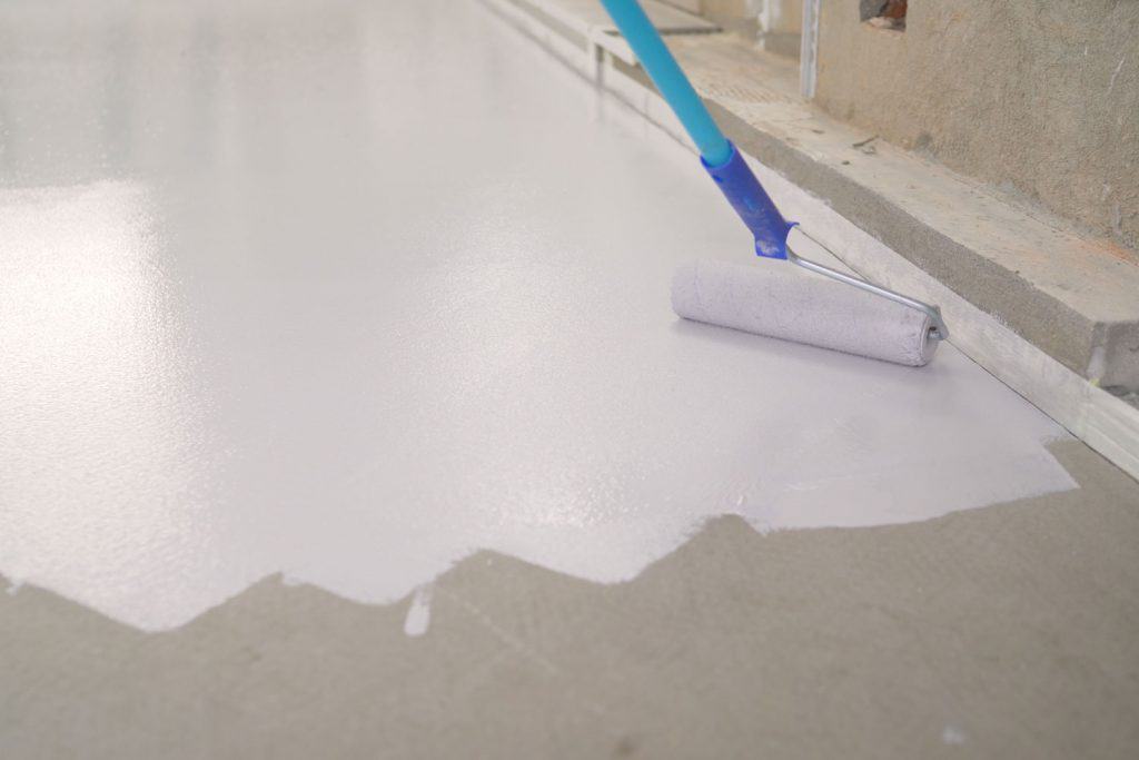 Painting the floor with white epoxy paint
