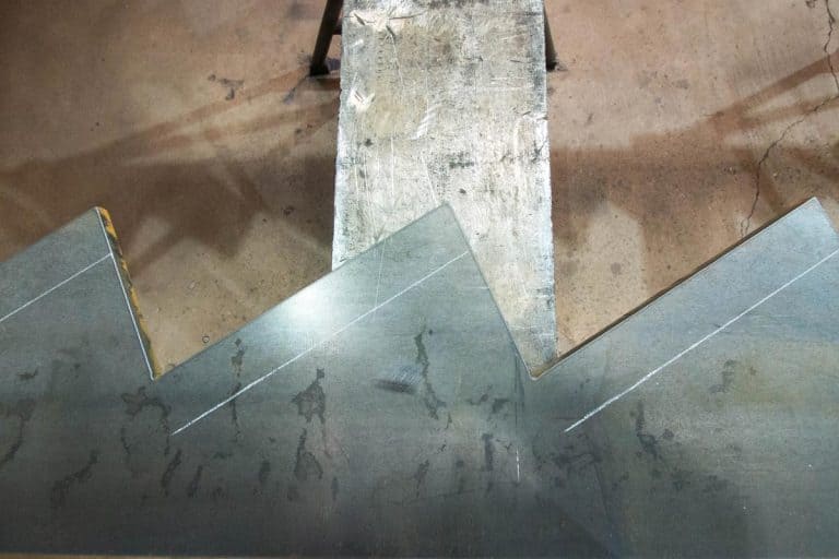 Steel plate cut in zigzag pattern for stair stringer fabrication, What Are Bilco Stair Stringers Made Of? [And What Sizes Are They]