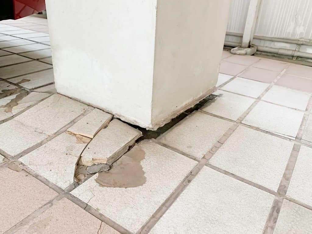 The movement of soil make the crack between pile and tile floor